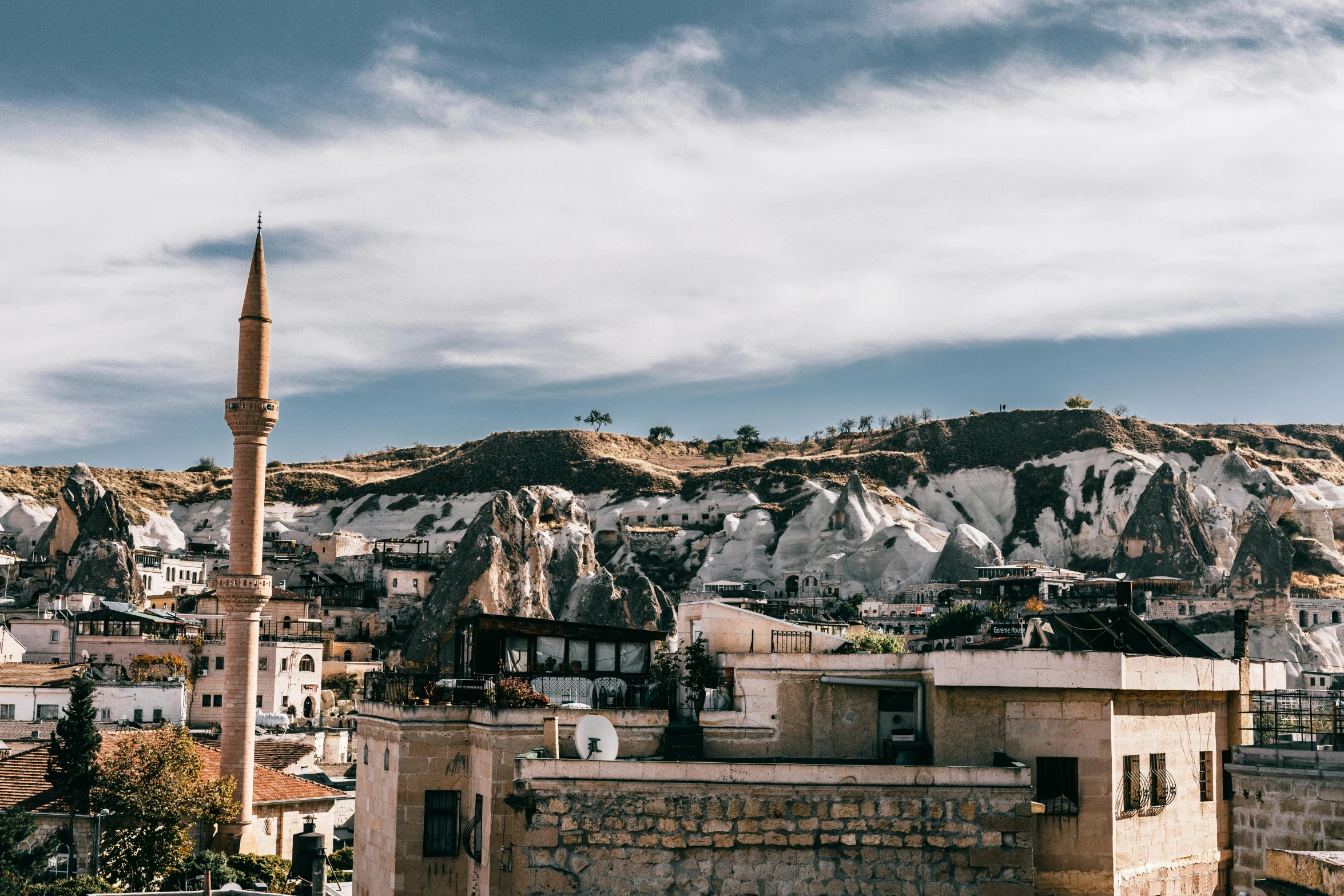 a view of a city with a mountain in the background, a marble sculpture, pexels contest winner, hurufiyya, hiding in the rooftops, turkey, beige, a quaint