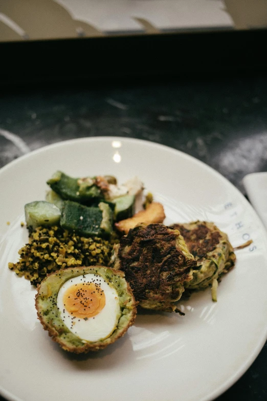 a close up of a plate of food on a table, by Jessie Algie, eggs, chuvabak, grilled artichoke, avocado