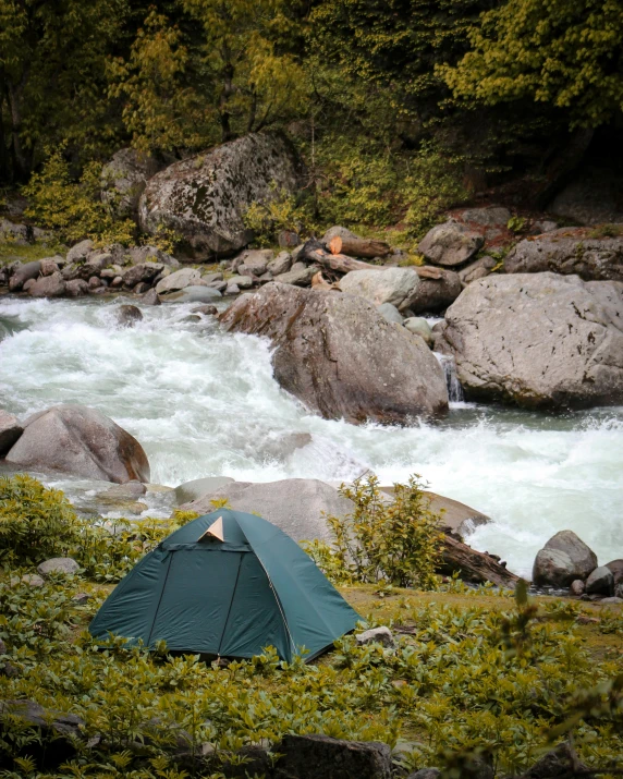 a tent pitched up next to a river, hurufiyya, profile image, chamonix, rapids, portait image