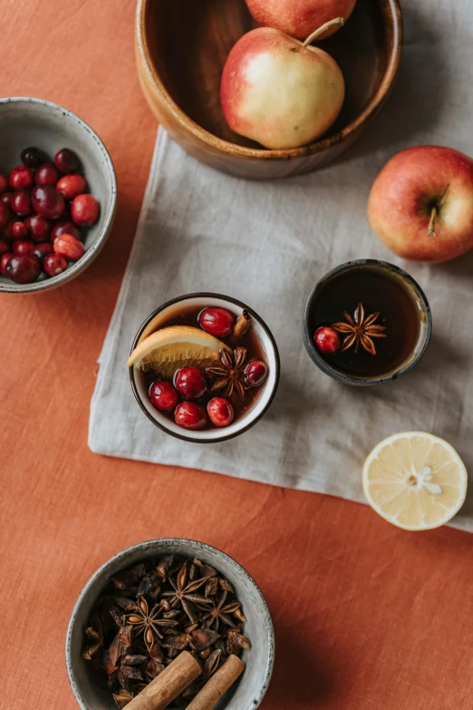 a table topped with bowls of fruit and spices, a still life, trending on pexels, maple syrup, square, seasonal, wall