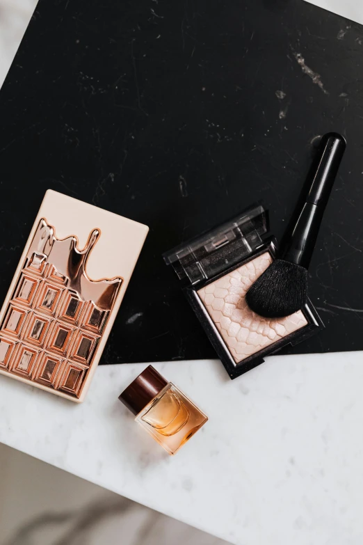 makeup products laid out on a marble table, a still life, by Julia Pishtar, baroque, rectangle, bronze, icon, or black