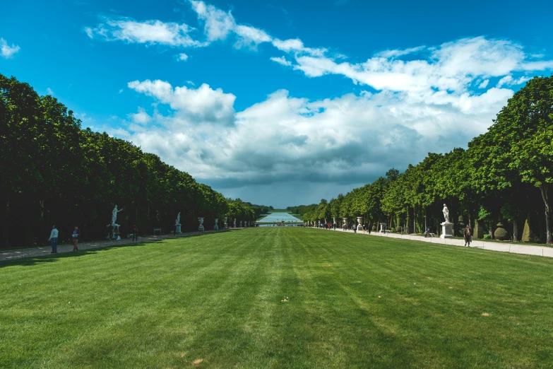 a park filled with lots of green grass and trees, by Daniel Gelon, pexels contest winner, visual art, royal palace near the lake, crisp lines, louis xiv, ground level camera view