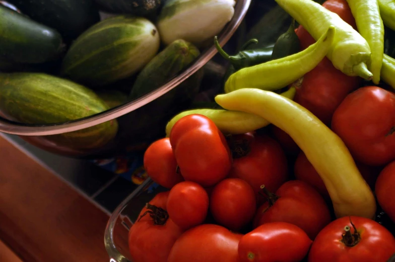 a close up of a bowl of tomatoes and cucumbers, precisionism, multiple stories, thumbnail, cornucopia, on kitchen table