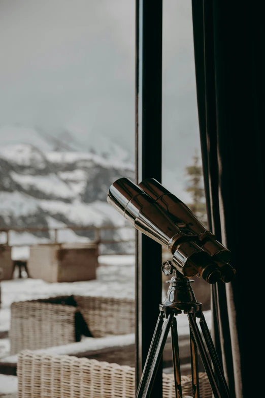 a telescope sitting on top of a tripod next to a window, by Sebastian Spreng, winter setting, luxurious environment, **cinematic, multiple stories