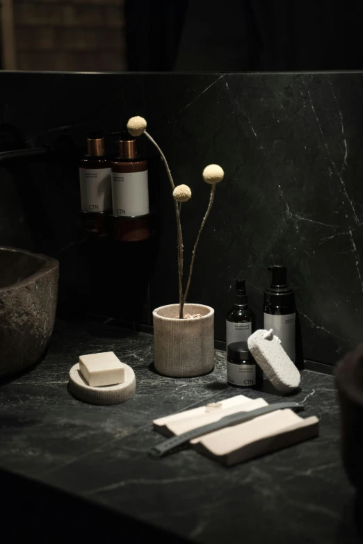 a bath room with a sink and a mirror, a still life, inspired by Caro Niederer, unsplash, on black background, marble sculptures, apothecary, japanese collection product