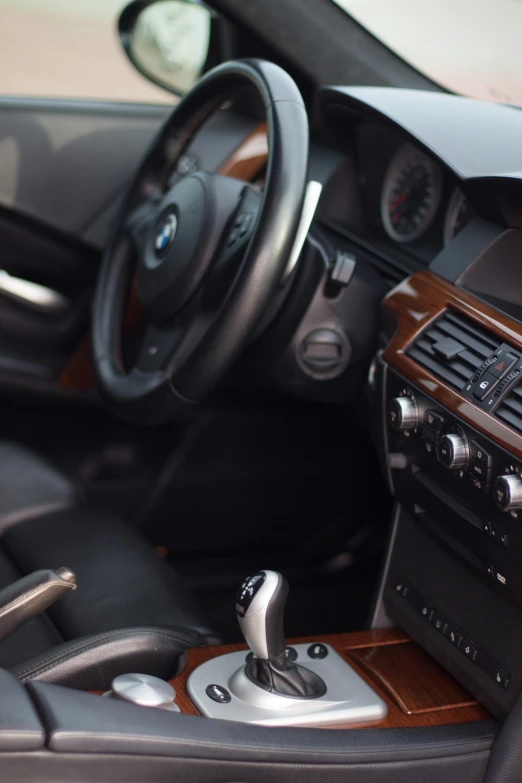 a close up of a dashboard of a car, unsplash, photorealism, bmw, brown, hyperdetailed photorealism”, taken in the late 2010s