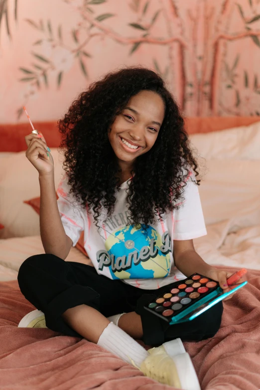 a beautiful young woman sitting on top of a bed, trending on pexels, happening, super cute funky black girl, in professional makeup, aged 13, with long curly