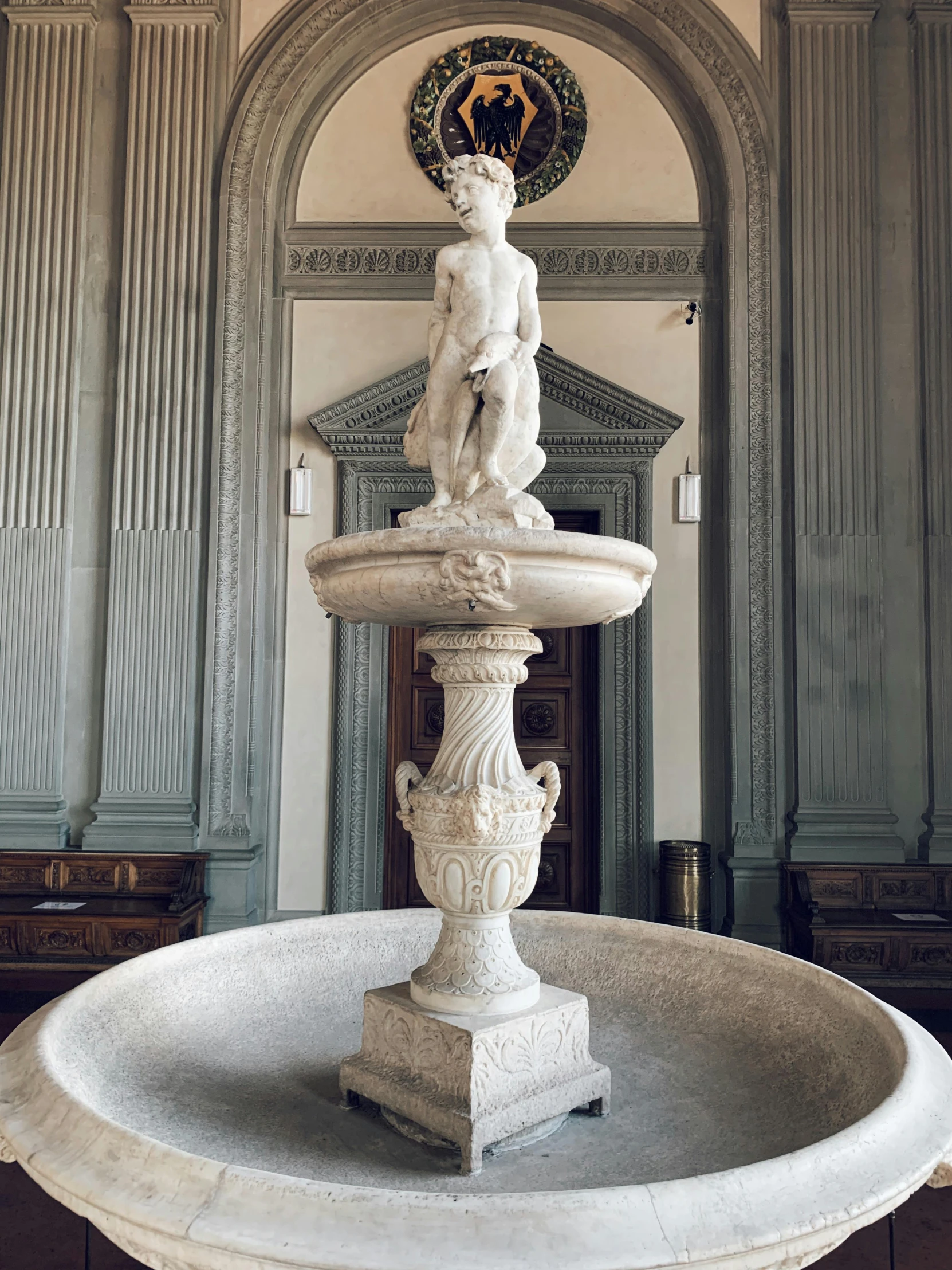 a fountain with a statue on top of it, a marble sculpture, in a museum room, saturno buttò, waist up, 4k museum photograph