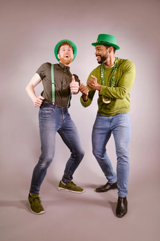 a couple of men standing next to each other, inspired by Luigi Kasimir, pexels, full body with costume, irish, hr ginger, smiling and dancing