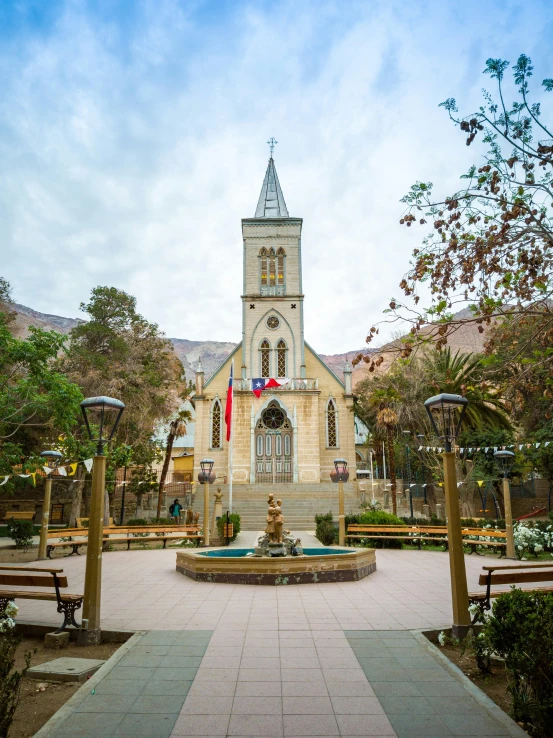 a church with a fountain in front of it, by Daniel Lieske, unsplash, quito school, tehran, french village exterior, square, panoramic