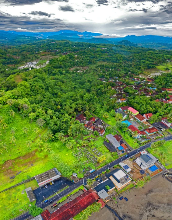 an aerial view of a village with mountains in the background, inspired by Erik Pevernagie, sumatraism, background image, thumbnail, seaside, hdr on