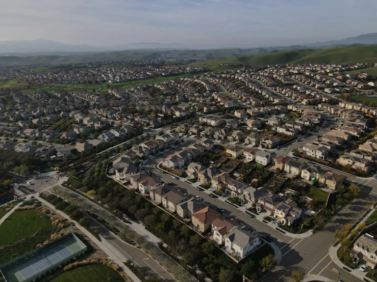 an aerial view of a residential neighborhood in california, reddit, photorealism, high res 8k, villages ， unreal engine, drone photograpghy, 8k resolution”