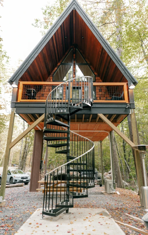 a tree house sitting in the middle of a forest, penrose stairs, - 6