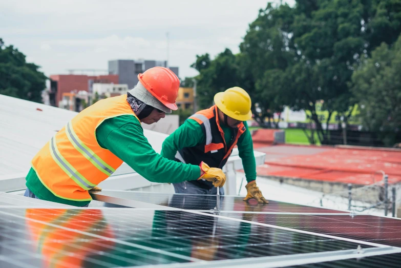 two workers installing solar panels on a roof, a photo, pexels contest winner, renaissance, brightly coloured, a green, 🦩🪐🐞👩🏻🦳, people at work