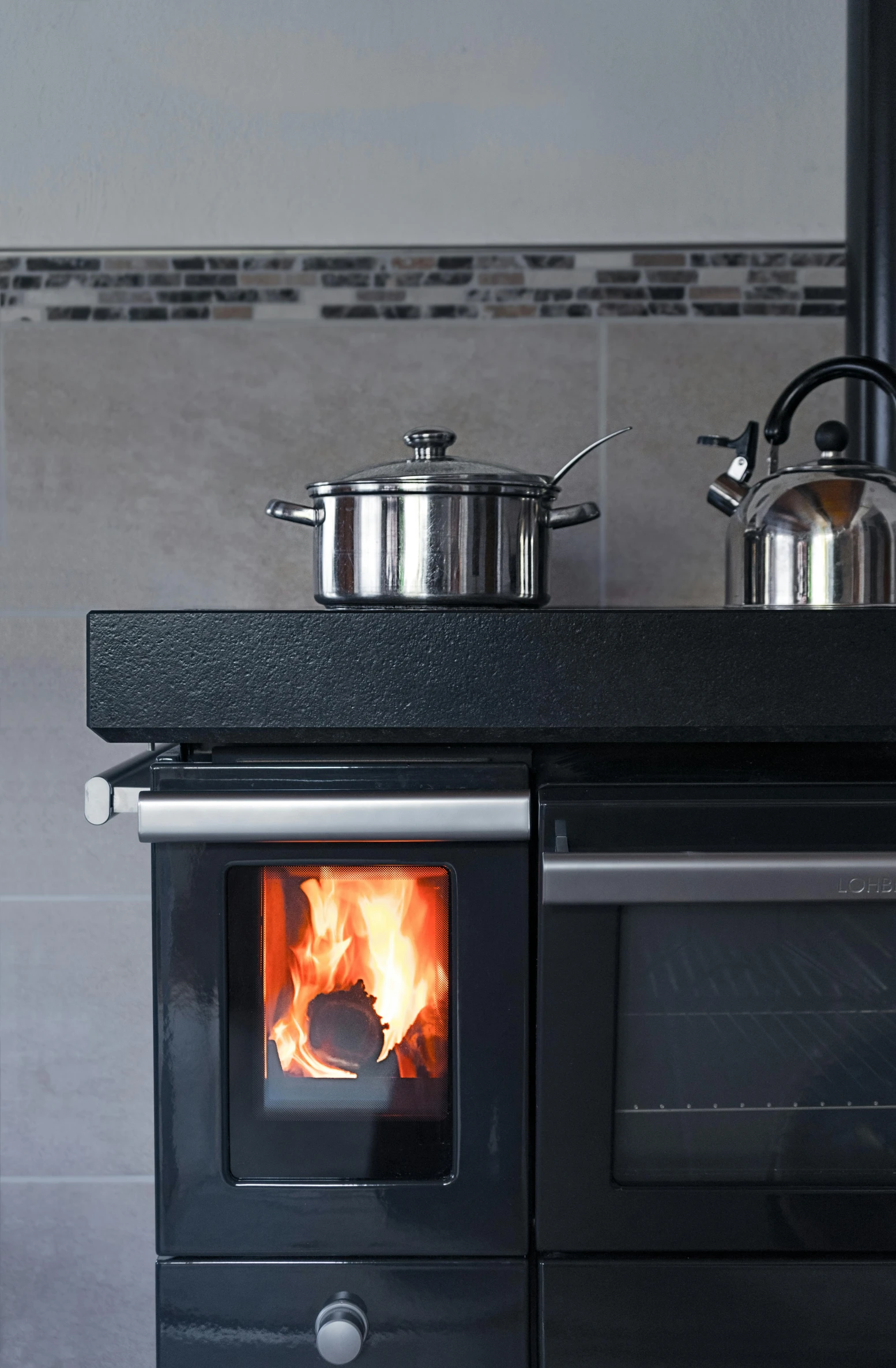 a stove top oven sitting inside of a kitchen, inspired by Jan Kupecký, close up shot from the side, winter setting, deep black, thumbnail