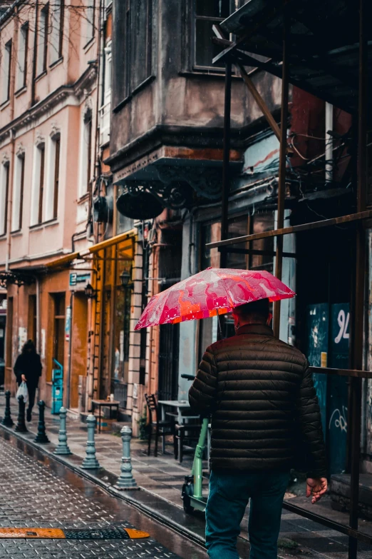 a person walking down a street with an umbrella, alleyway, red building, in the middle of the city, romanian