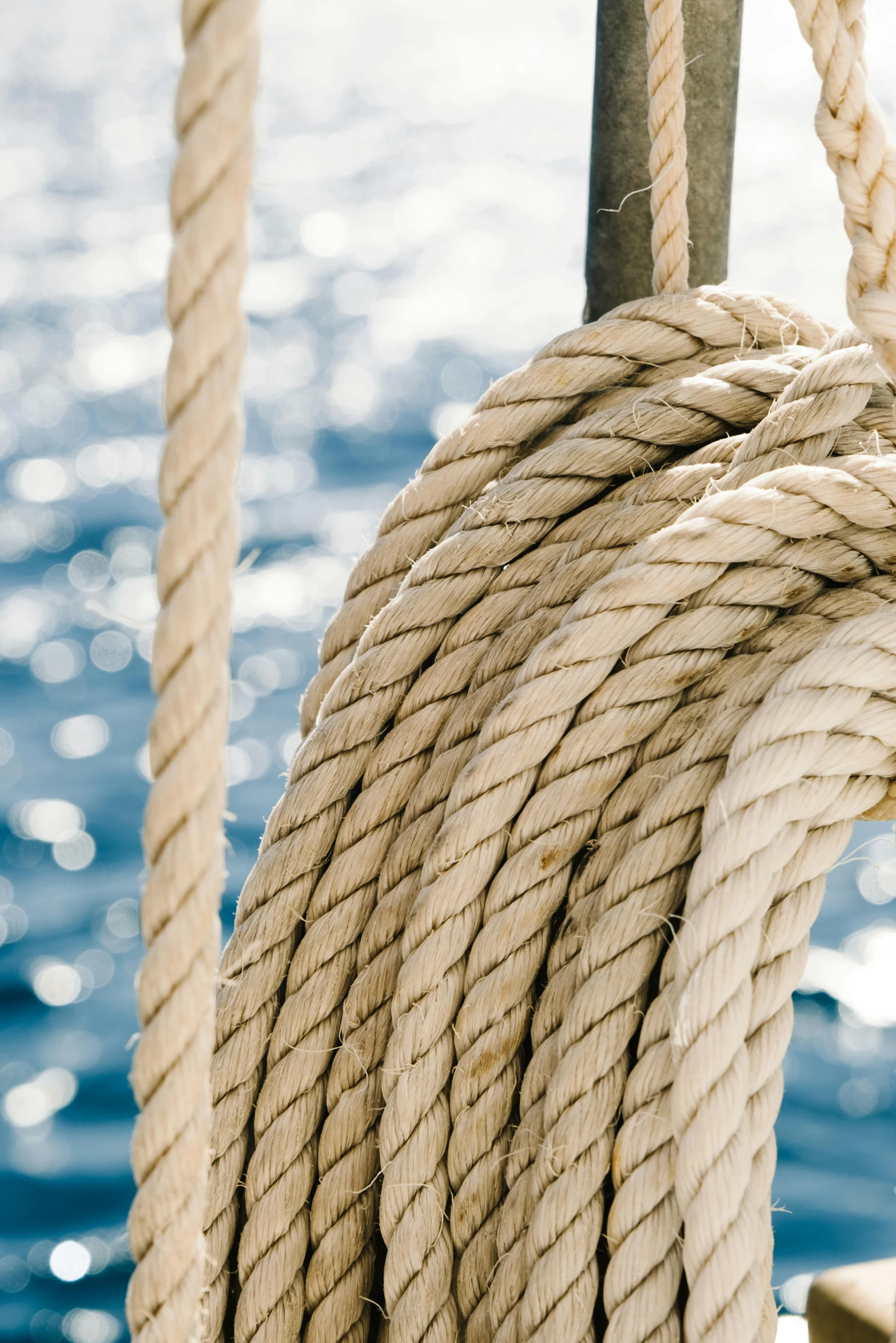 a close up of a rope on a boat, on the ocean, three masts, camaraderie, sustainable materials