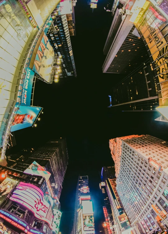 a panoramic view of a city at night, pexels contest winner, in time square, perspective from below, educational, square