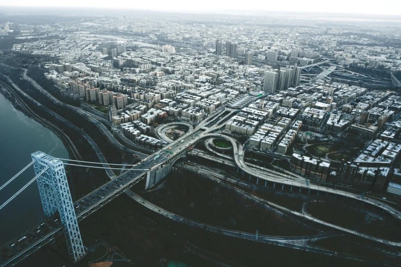 an aerial view of a bridge over a city, by Carey Morris, pexels contest winner, new jersey, complex structures, from the distance, intersection