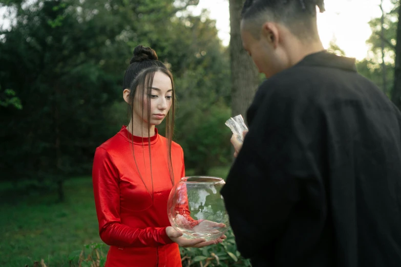 a man standing next to a woman in a red dress, pexels contest winner, witch paying for her sins, james jean and fenghua zhong, in the garden, portrait sophie mudd