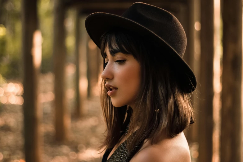 a close up of a person wearing a hat, inspired by Elsa Bleda, trending on pexels, brown bangs, beautiful asian girl, profile pic, black fedora