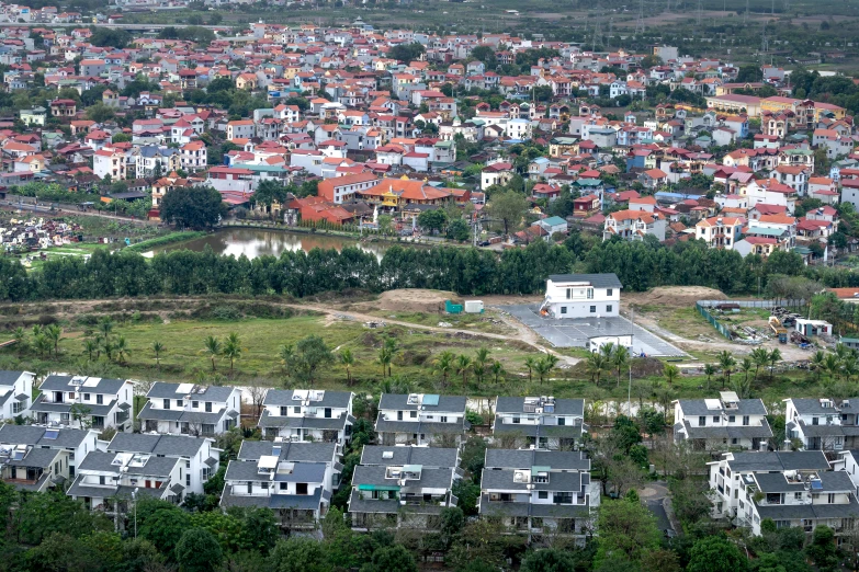 an aerial view of a city with lots of houses, a portrait, flickr, vietnam, zezhou chen, 2 0 2 2 photo, gigapixel photo