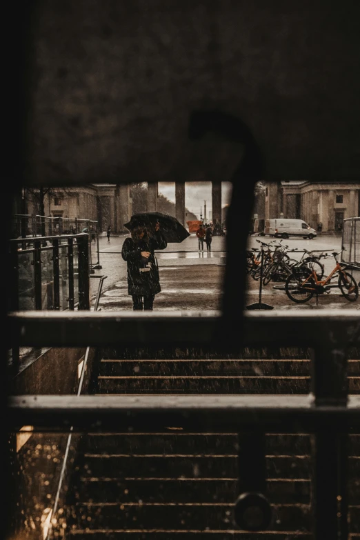 a person walking in the rain with an umbrella, inside berghain, looking through a window frame, unsplash photography, square