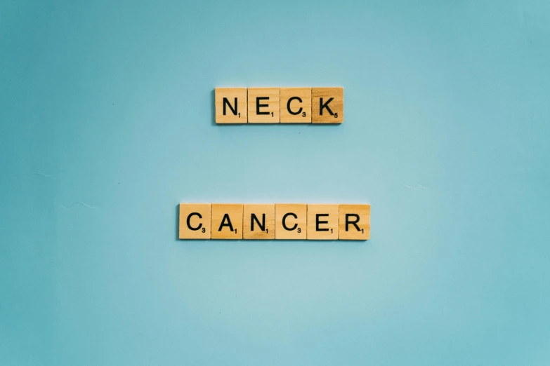 the word neck cancer spelled with scrabbles on a blue background, an album cover, by Niko Henrichon, pexels contest winner, collar around neck, nut, green neon signs, on a gray background