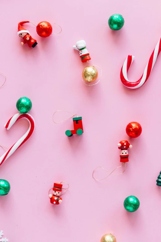 candy canes and christmas ornaments on a pink background, trending on pexels, mini model, multiple colors, n 2, x