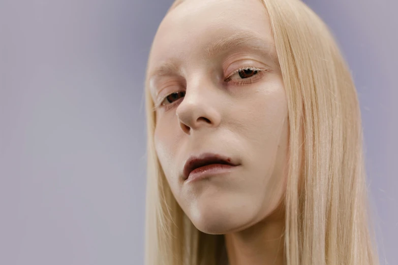 a close up of a woman with long blonde hair, inspired by Vanessa Beecroft, emaciated shaved face, iridescent skin, integrated synthetic android, non binary model