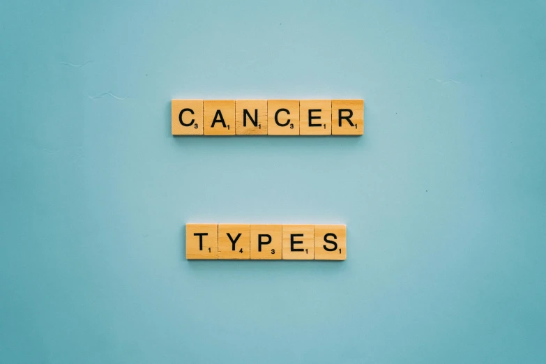 wooden scrabbles spelling cancer types on a blue background, by Caro Niederer, pexels, graffiti, a green, calotype, - 12p, medical labels