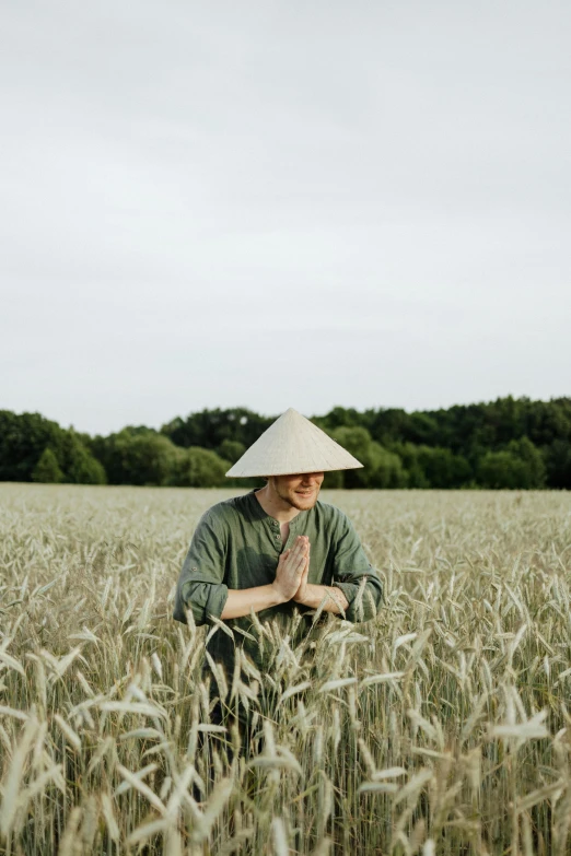 a man kneeling in a field of wheat, by Tobias Stimmer, unsplash, renaissance, vietnamese woman, made of bamboo, greeting hand on head, avatar image