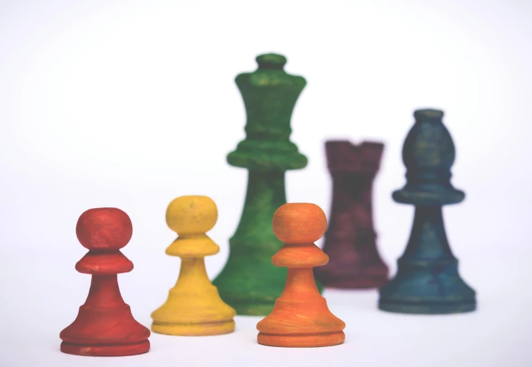 a group of chess pieces sitting next to each other, by Emma Andijewska, rainbow colored, thumbnail, wooden, islamic