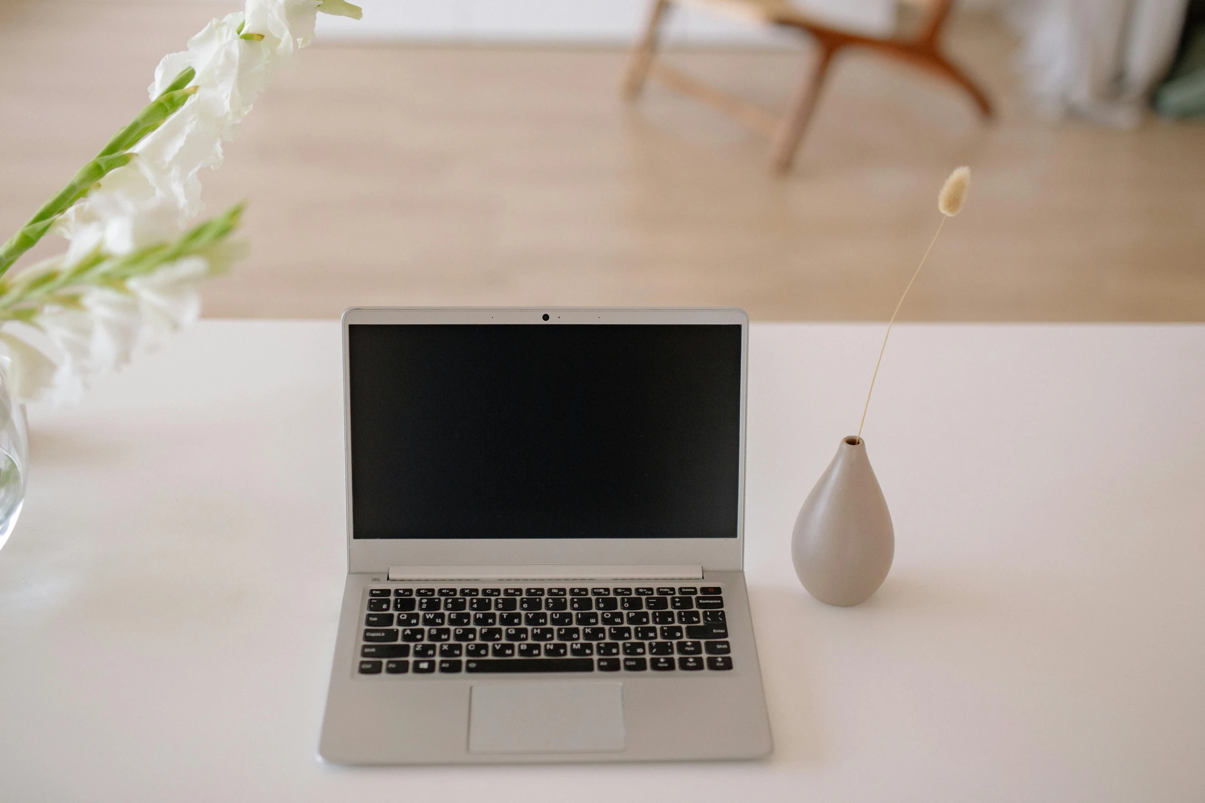 a laptop computer sitting on top of a white table, unsplash, silver，ivory, blooming, indoors, rectangle