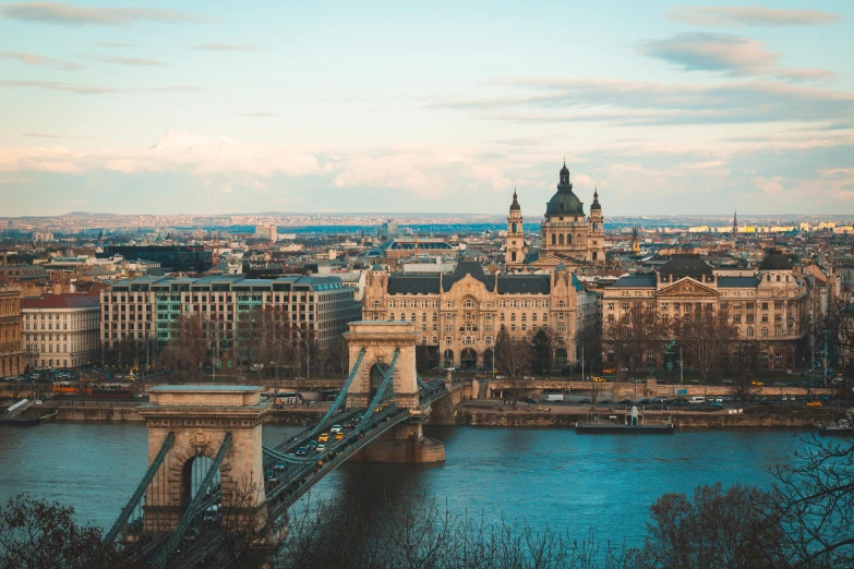 a bridge over a river with buildings in the background, by Adam Szentpétery, pexels contest winner, art nouveau, aerial view of a city, grand budapest hotel, white marble buildings, 🦩🪐🐞👩🏻🦳