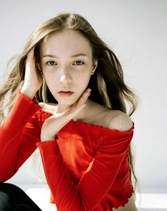 a beautiful young woman sitting on top of a bed, by Elizabeth Polunin, trending on pexels, antipodeans, human face with bright red yes, jaeyeon nam, 1 6 years old, with high cheekbones
