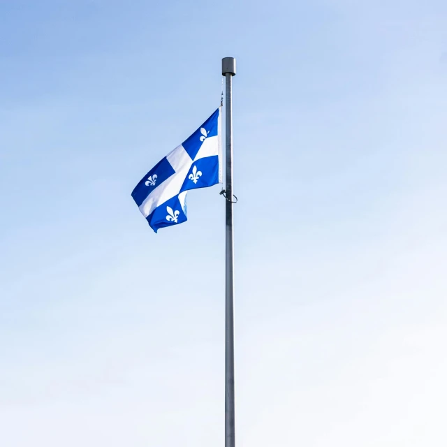 a blue and white flag flying on top of a flag pole, a portrait, by Etienne Delessert, unsplash, quebec, square, southern cross, low quality photo