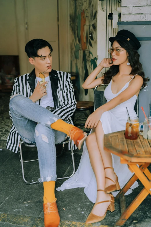 a man and a woman sitting at a table, pexels contest winner, in style of lam manh, outfit photo, 15081959 21121991 01012000 4k, album photo