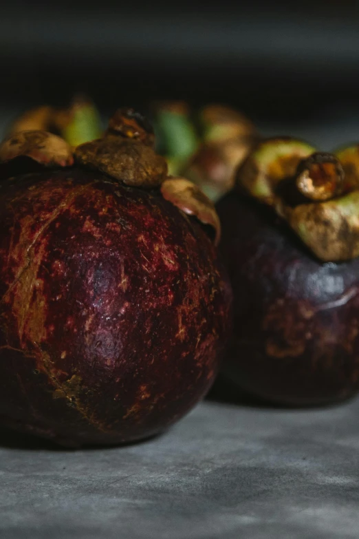 a close up of a bunch of fruit on a table, mangosteen, alessio albi, f / 2 0, organics