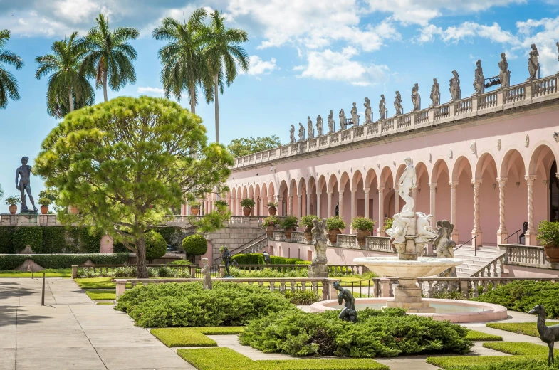 a pink building with a fountain in front of it, archways made of lush greenery, miami, formal gardens, avatar image