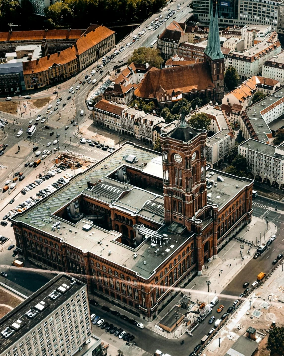 an aerial view of a city with a clock tower, by Christen Dalsgaard, pexels contest winner, hyperrealism, brick building, research complex, historic photo