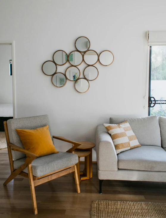 a living room filled with furniture and a window, a picture, featured on pinterest, circular glasses, mirror background, set photo, manuka