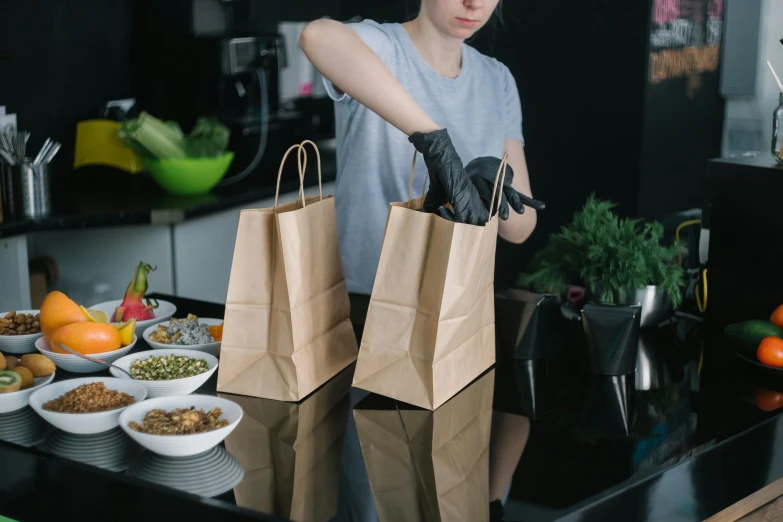 a woman preparing a meal in a kitchen, pexels contest winner, happening, bags of money, avatar image, exiting store, female thief