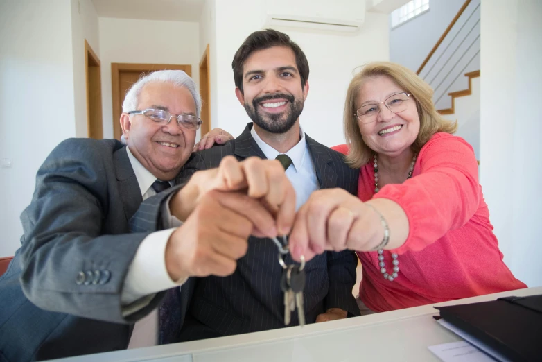 a group of people standing next to each other holding keys, luis melo, at home, avatar image, professional image