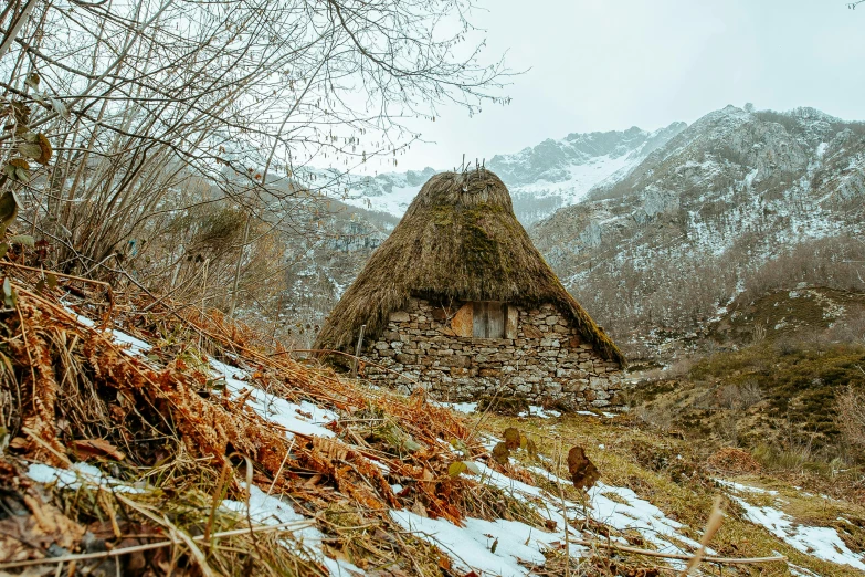 a thatched roof sitting on top of a snow covered hillside, by Muggur, unsplash contest winner, renaissance, avatar image, full body image, turkey, 90's photo