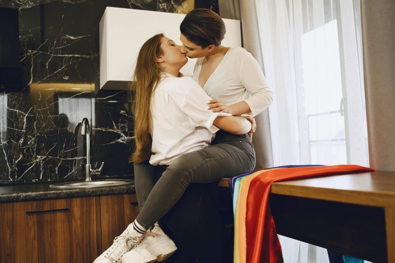 a woman sitting on top of a counter next to a woman, trending on pexels, lesbian embrace, 15081959 21121991 01012000 4k, marton gyula kiss ( kimagu ), brown