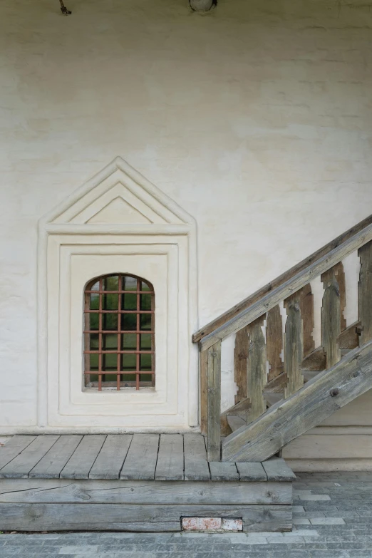 a red fire hydrant sitting in front of a white building, a painting, inspired by Konstantin Vasilyev, renaissance, wooden stairs, light - brown wall, 1 5 9 5, church window