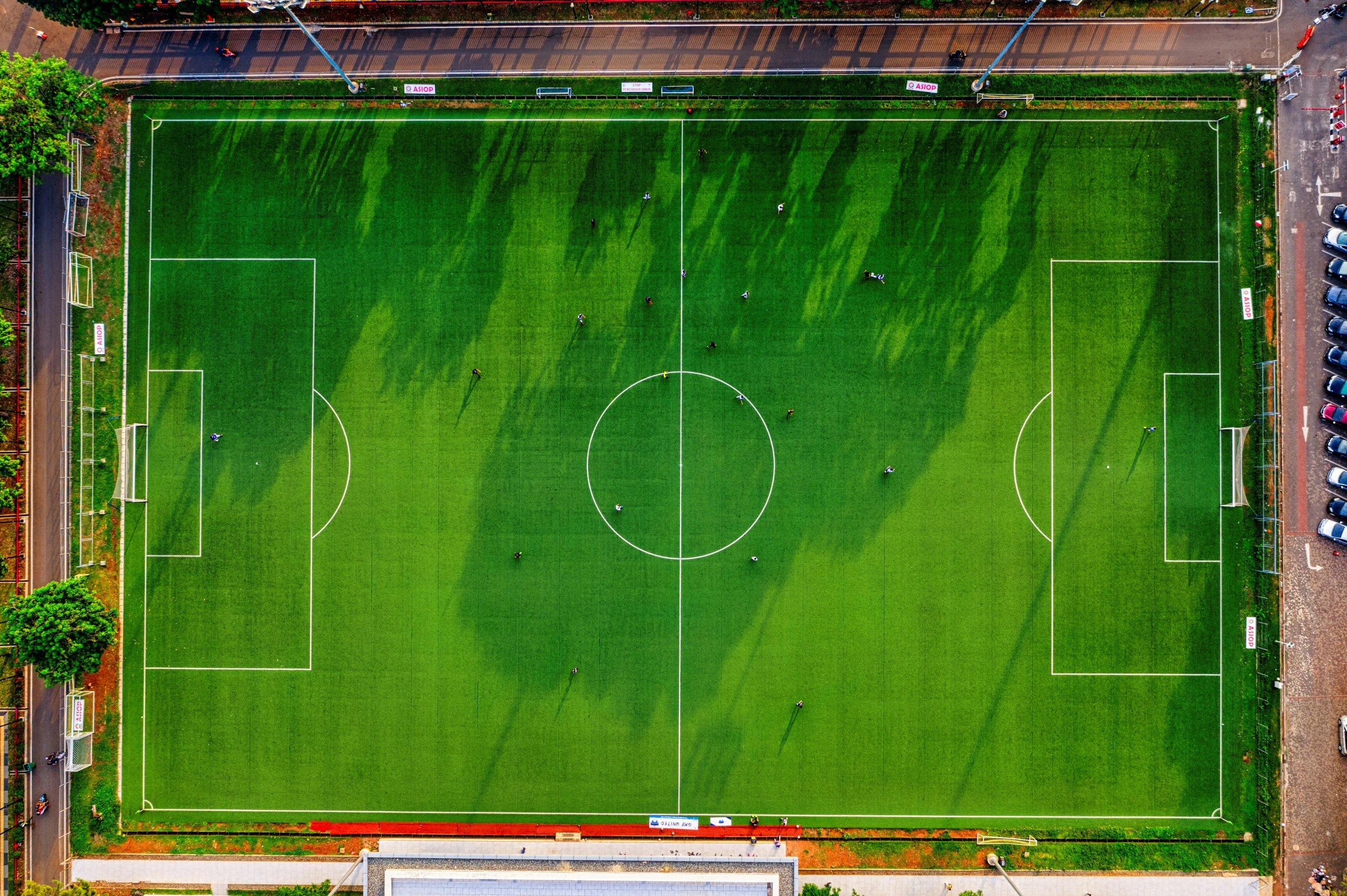 an aerial view of a soccer field, by Paul Bird, pexels contest winner, ground angle uhd 8 k, panels, ilustration, helicopter view