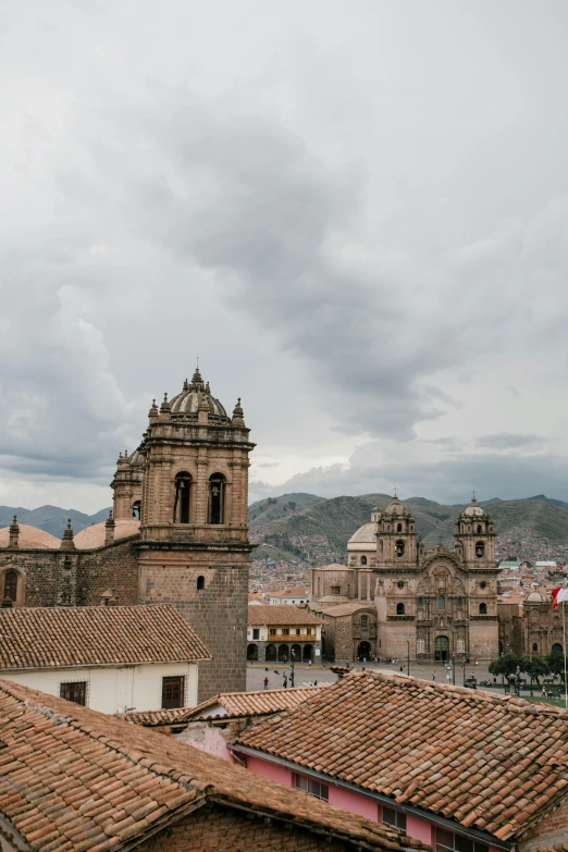 a view of a city from the top of a building, by Tobias Stimmer, trending on unsplash, quito school, machu picchu, square, gray skies, with great domes and arches