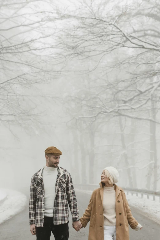 a man and a woman walking down a snowy road, pexels contest winner, foggy forrest backdrop, looking off to the side, brown, promotional image